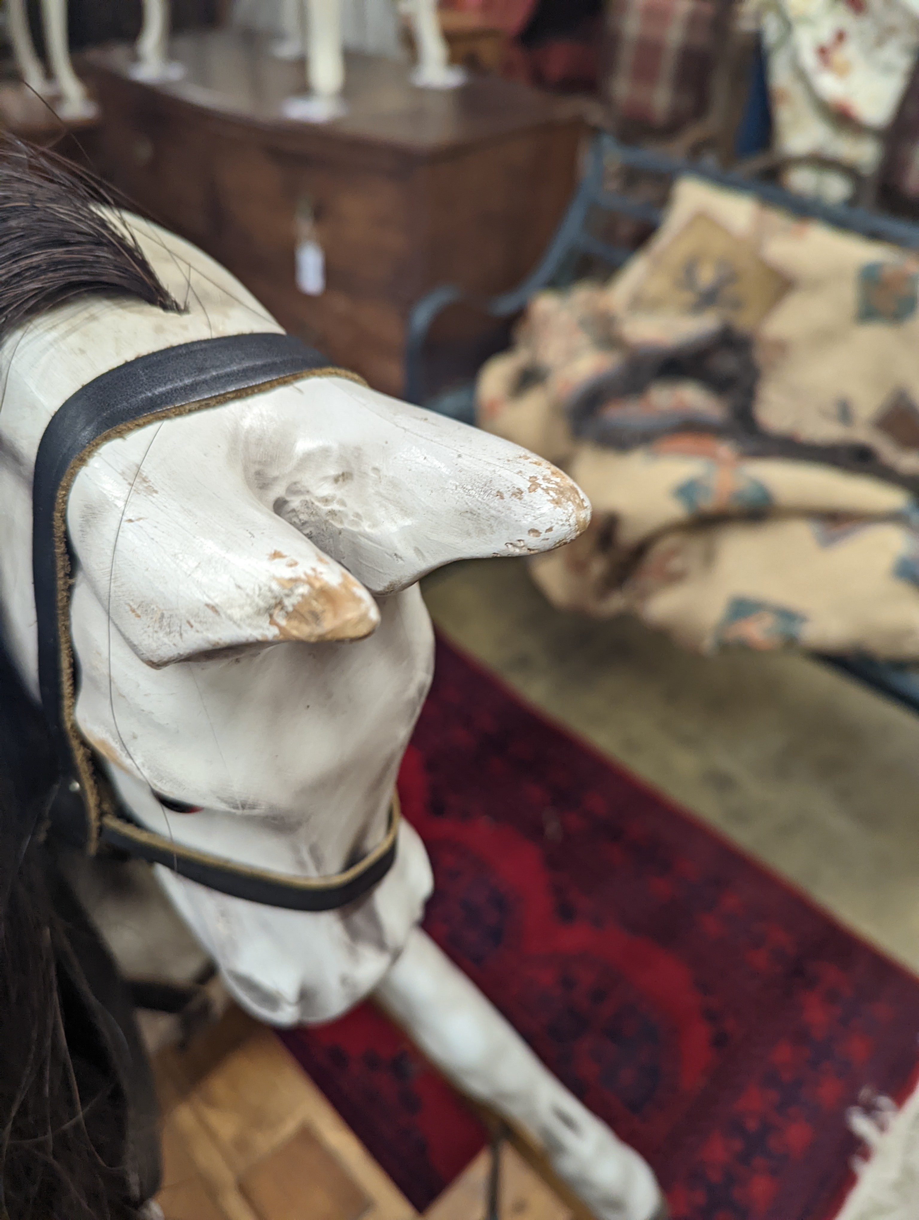 A Victorian style dapple grey rocking horse on pine stand, length 152cm, height 126cm